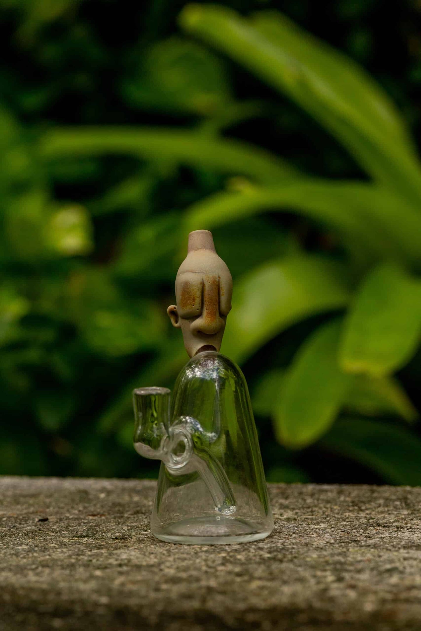 artisan-crafted design of the (Gomez 18) Silver Strike Mini Neolithic Head Rig by Gomez Glass