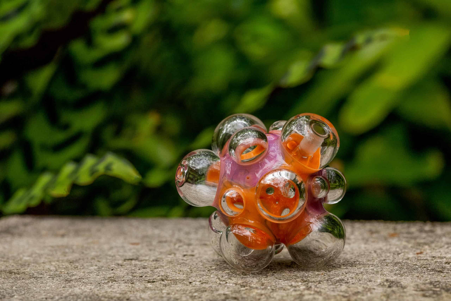 hand-blown design of the Orange/Pink Scribble Bubball Rig by Scomo Moanet