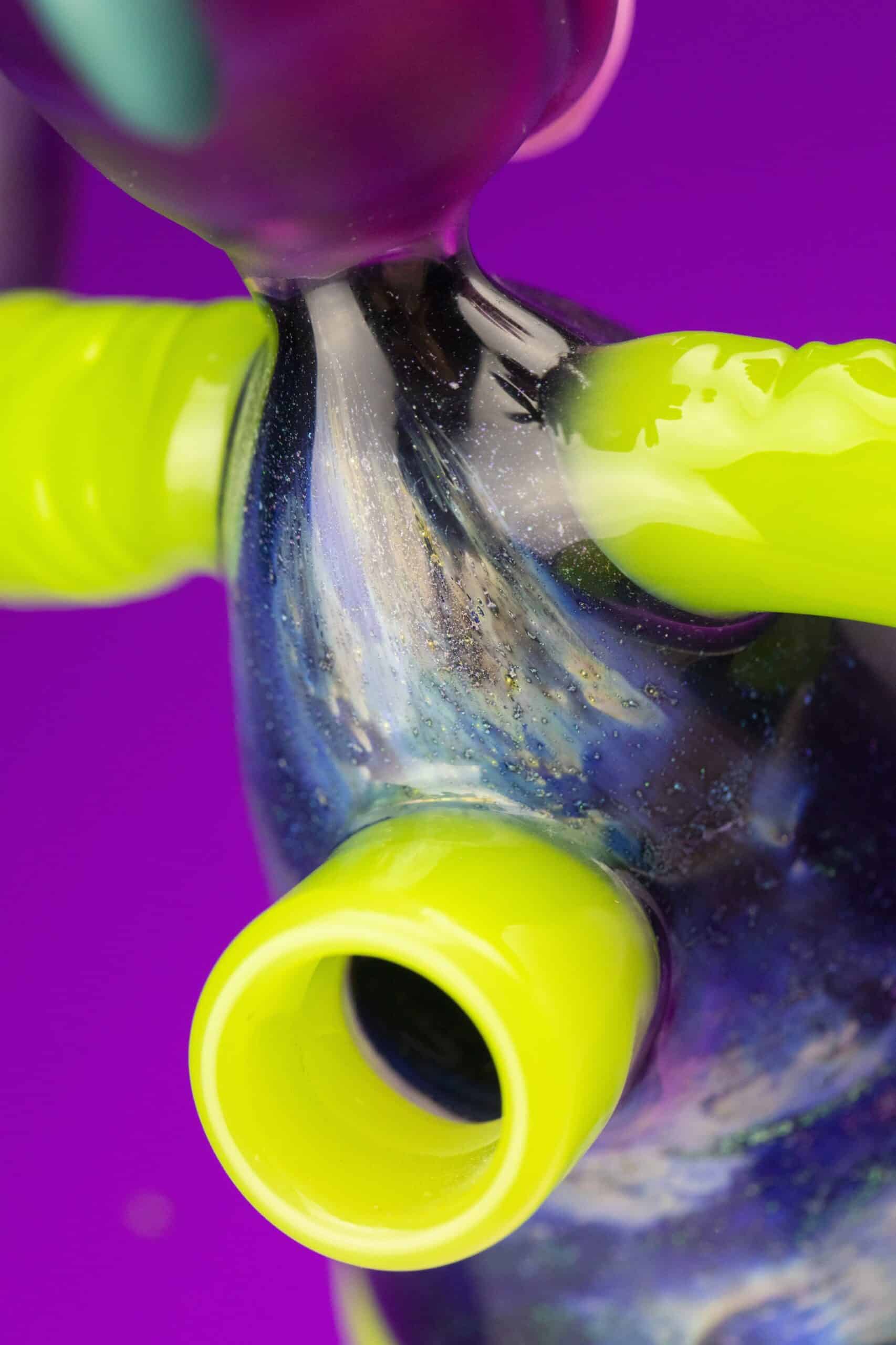 hand-blown design of the Fume City Glass Collaboration Half Body Rig w/ Opal Earrings & Gold Grill by Ryder Glass