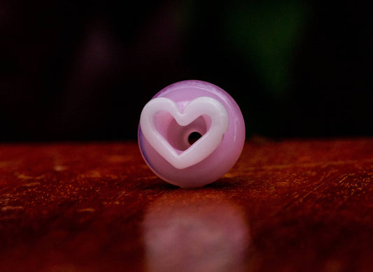 premium quality design of the (SP5) Solid Pink / Glow In The Dark UV White Heart Puffco Peak Carb Cap by Sakibomb