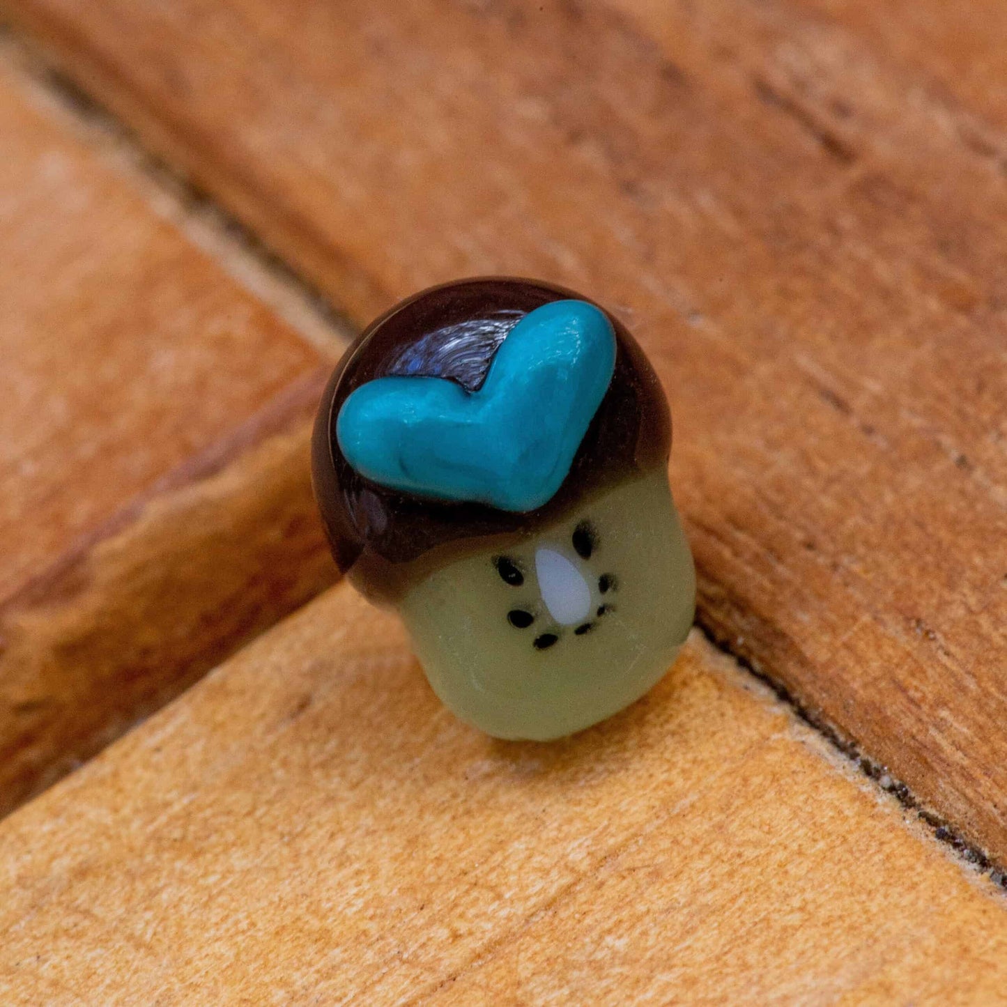 meticulously crafted art piece - Tiny Flat Kiwi Pearl w/ Turquoise Heart by Sakibomb