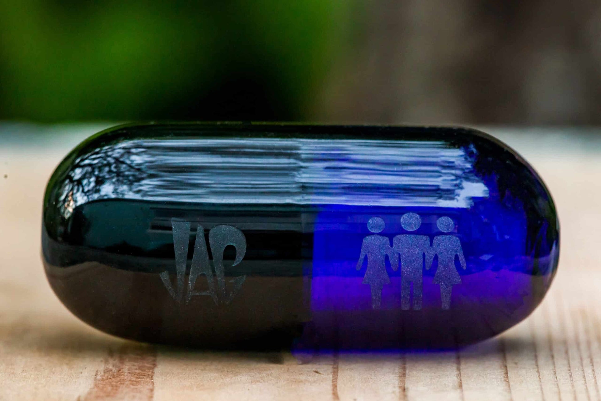hand-blown design of the Dark Blue Pill Hand Pipe by JAG