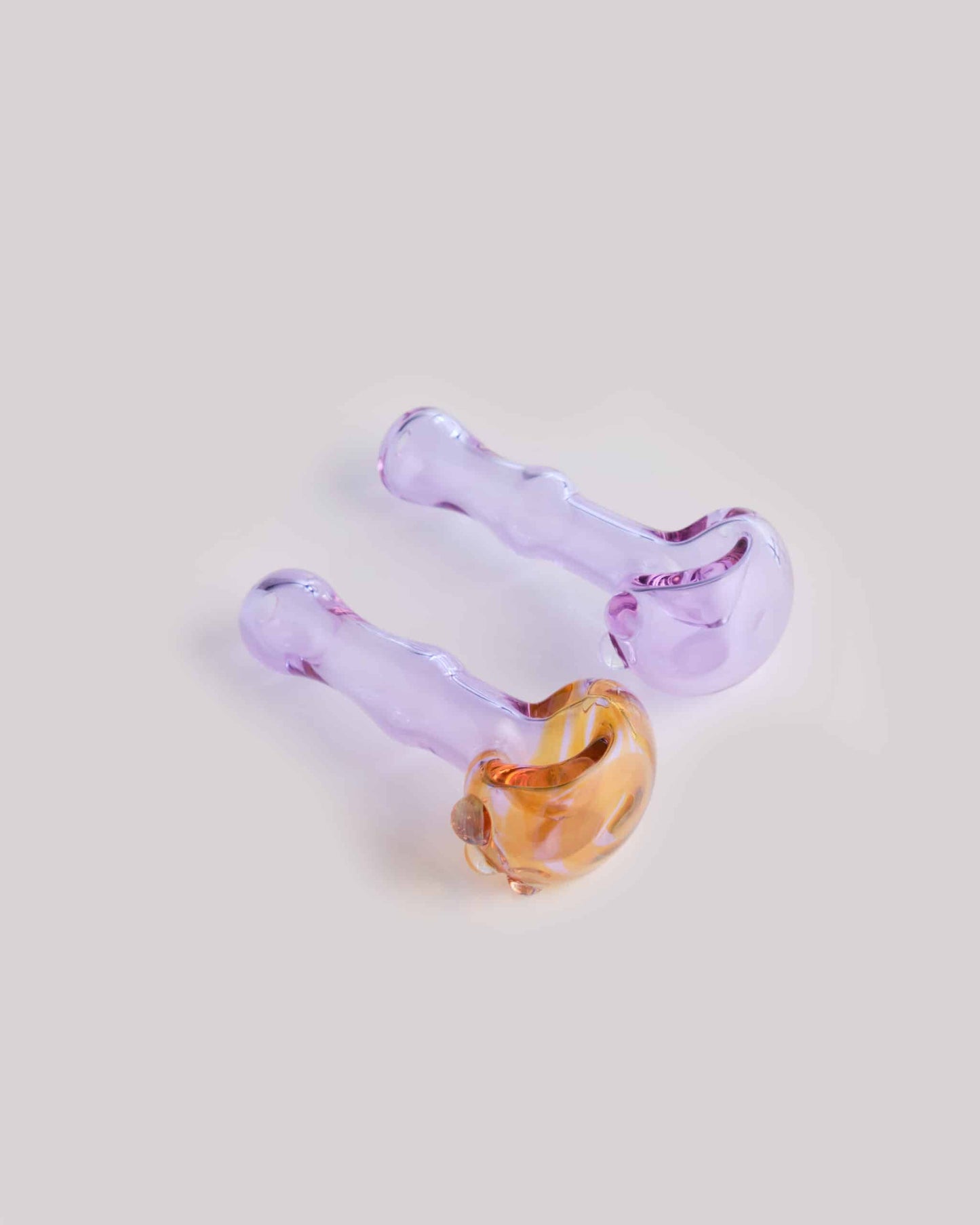 meticulously crafted design of the Pink/Yellow Spoon Pipe w/ Blue Swirl by Willy That Glass Guy